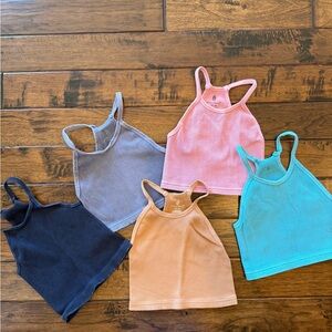 Bundle of FP Movement Racerback Tanks. Colors: caramel, pink, teal, navy & gray